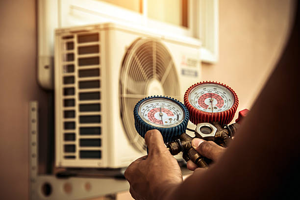 Professional Air Conditioning Service technician working in Plantation, FL